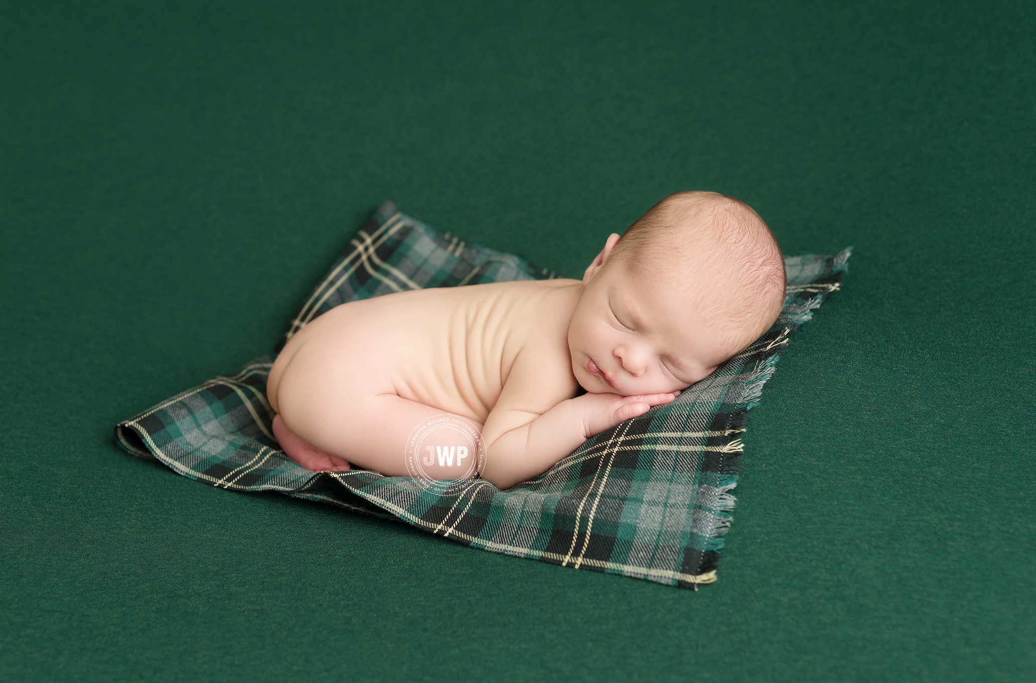 baby boy on green blanket and green plaid fabric in kingston baby studio by jennifer willard photography