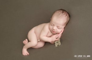 baby boy on green grey blanket with military army tags from father at RMC in kingston ontario portrait studio