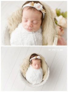 baby girl in white wrap with flower headband in white buck on white floor in newborn photography studio in kingston ontario_0001