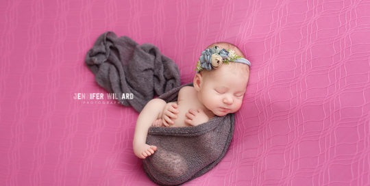 baby girl on pink with grey wrap and headband in kingston ontario with newborn photographer