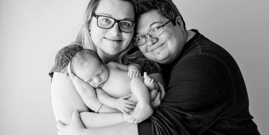 newborn baby with two moms portrait in kingston ontario photography studio_0006