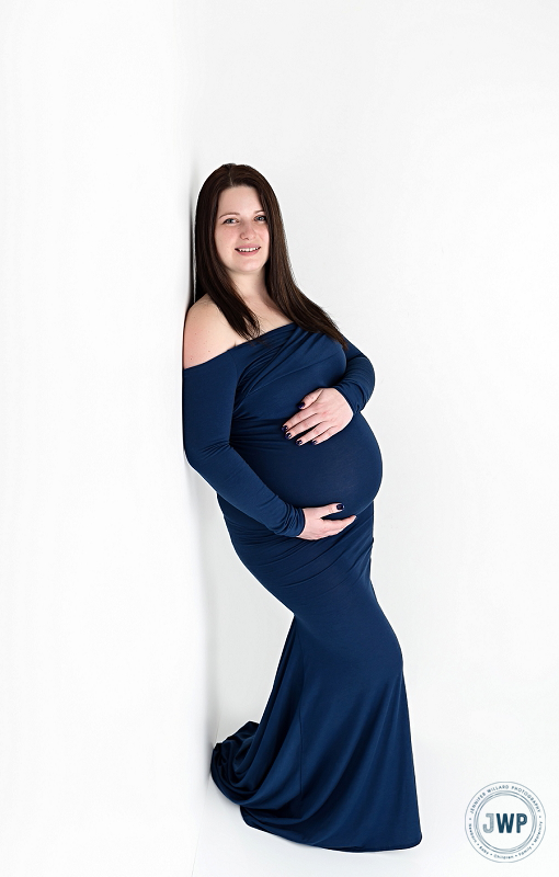 Pregnant Mom in blue dress by Kingston Maternity Photographer