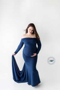 Pregnant Mom in blue dress by Kingston Maternity Photographer