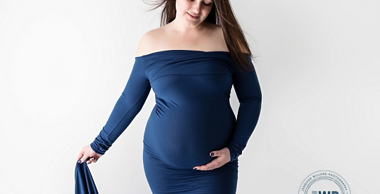 Pregnant Mom in blue dress by Kingston Maternity Photographer