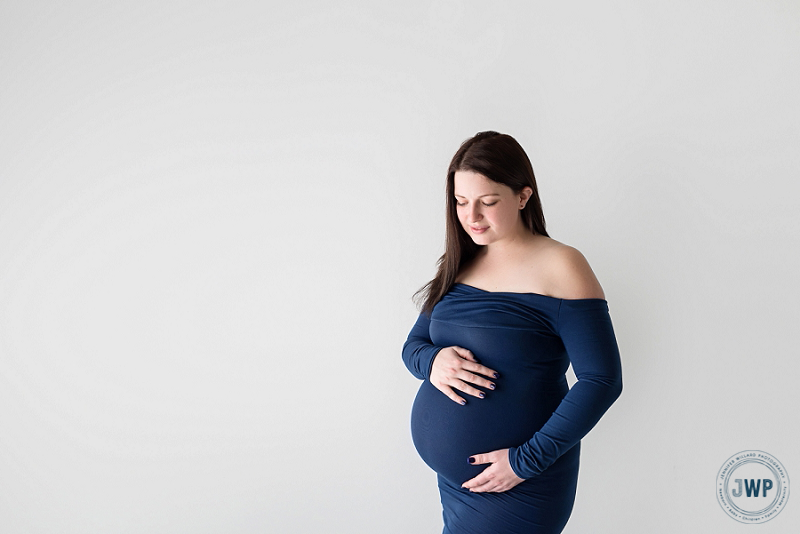 Pregnant Mom in blue dress by Kingston Maternity Photographer