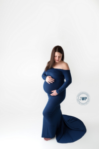 Pregnant Mom in blue dress by Kingston Maternity Photographer