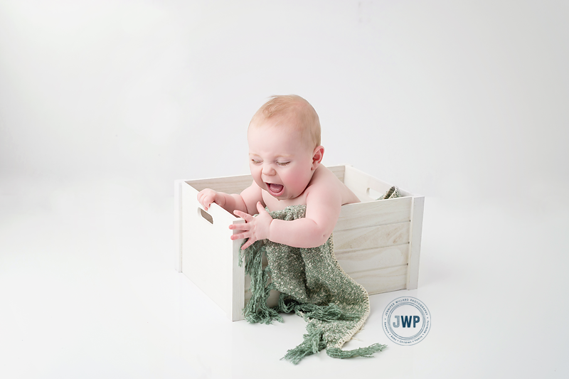 baby-boy-6-months-old-white-crate-green-scarf-Kingston-baby-photographer