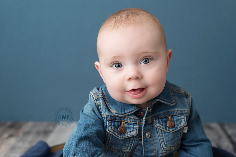 baby-boy-jean-jacket-blue-backdrop-kingston-baby-photographer