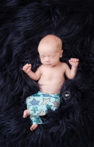 newborn-baby-boy-star-pants-blue-flokati-rug-Kingston-Newborn-Photographer