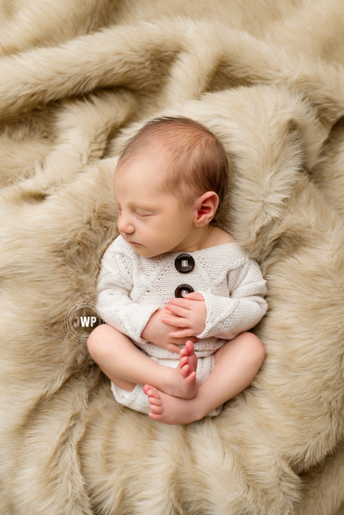 newborn baby girl in handmade romper on fur Kingston Photographer