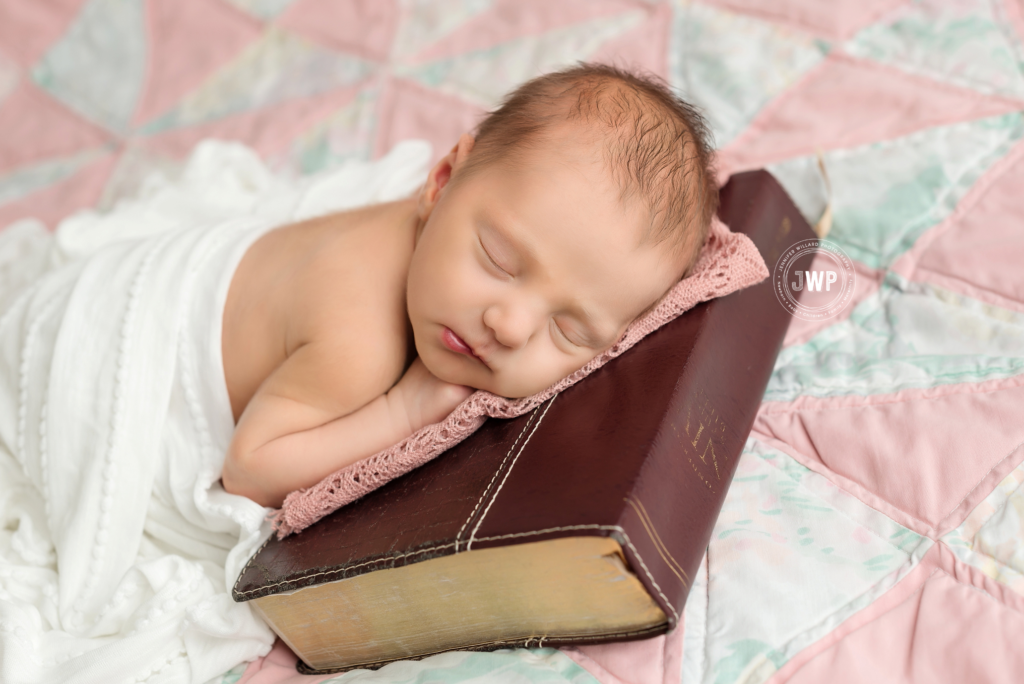 newborn baby girl with bible on handmade quilt with Kingston Newborn Photographer