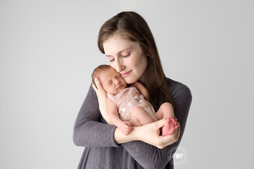 newborn baby girl with mother with eyes closed Kingston Newborn Photographer