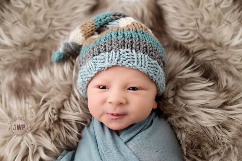 newborn posed portrait blue hat brown fur Kingston Newborn Photographer