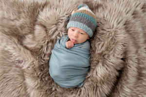 newborn posed portrait blue wrap brown fur Kingston Newborn Photographer