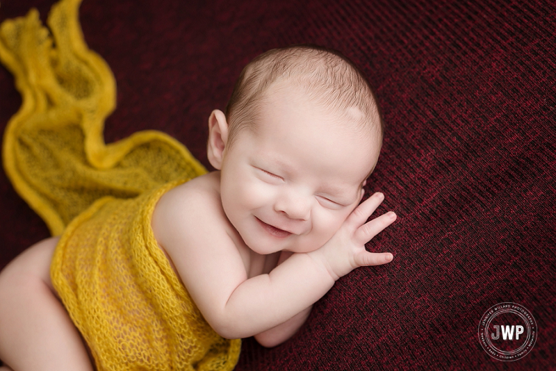 newborn posed portrait burgundy blanket yellow wrap Kingston Newborn Photographer