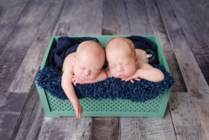 newborn-twin-boys-green-crate-grey-wood-floor-Kingston-Photographer