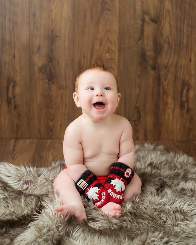 posed baby portrait 6 months old Canadian Gloves Kingston Children Photographer