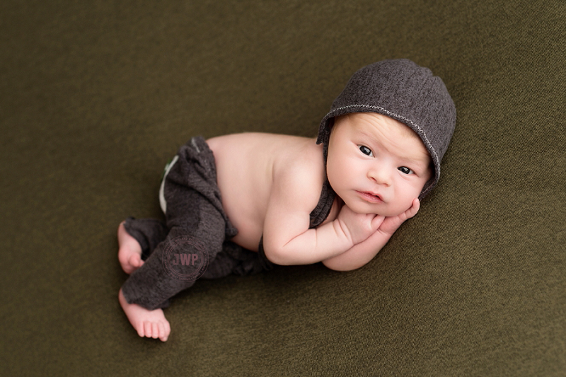 posed baby portrait 6 months old blue overalls Kingston Children Photographer