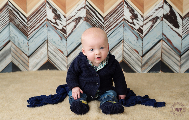 posed baby portrait 6 months old boy blue sweater Kingston Children Photographer