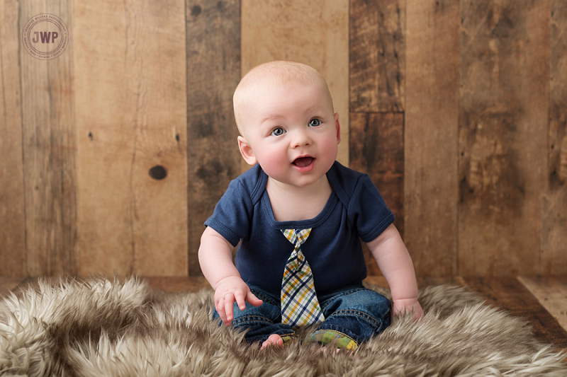 posed baby portrait 6 months old wood backdrop fur Kingston Children Photographer