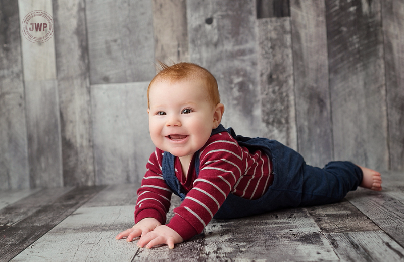 posed baby portrait 6 months old wood backdrop red shirt Kingston Children Photographer