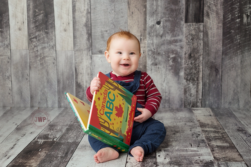 posed baby portrait 6 months old wood backdrop red shirt Kingston Children Photographer