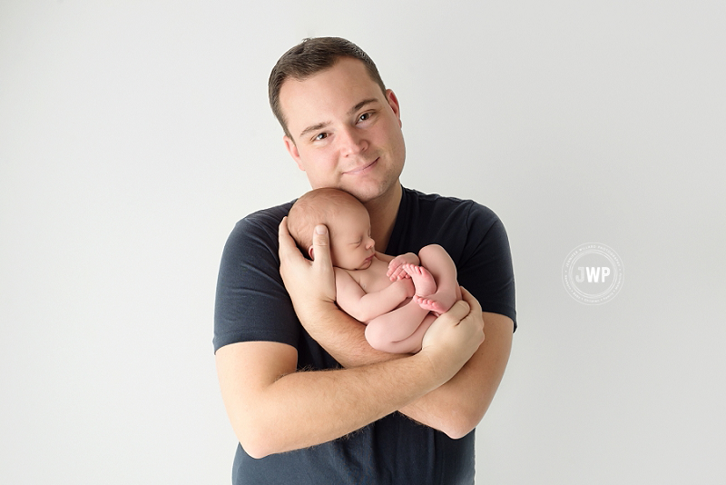 posed newborn picture father son Kingston Newborn Photographer