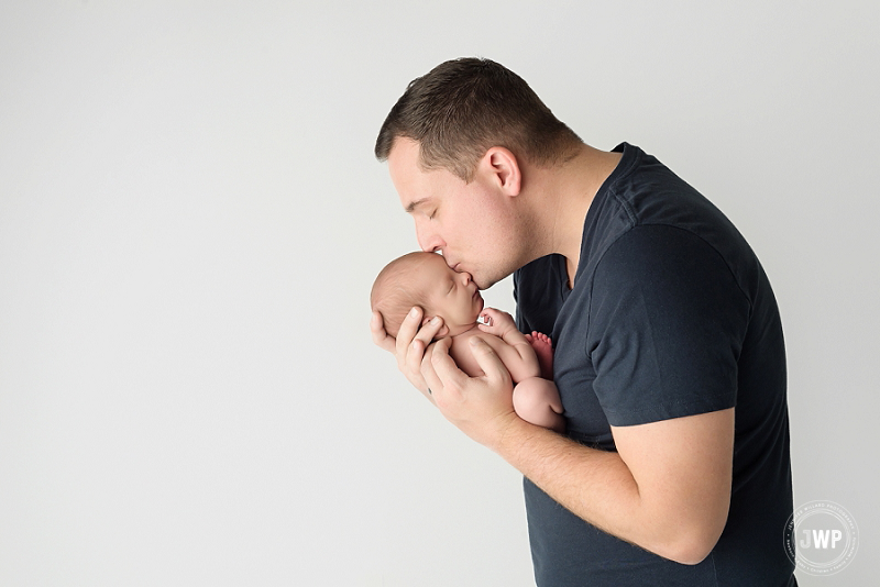 posed newborn picture father son Kingston Newborn Photographer