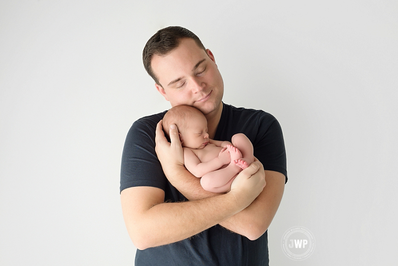 posed newborn picture father son Kingston Newborn Photographer