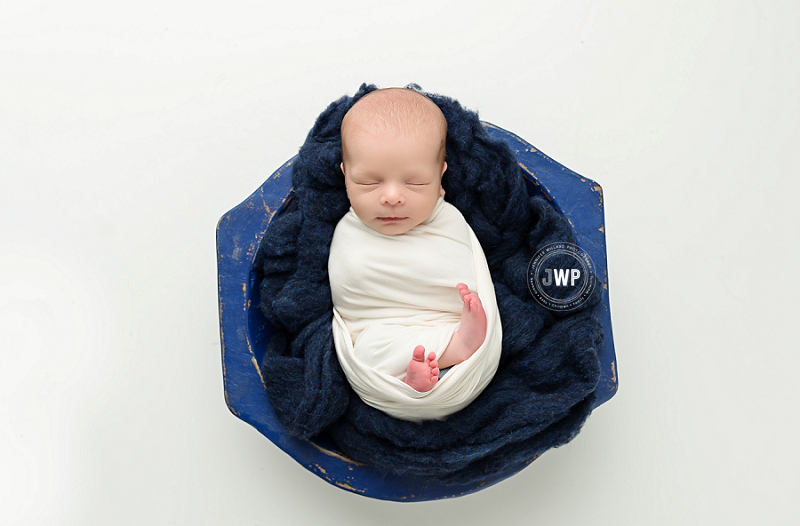 posed newborn portrait boy white wrap blue felt wood bowl Kingston Newborn Photographer