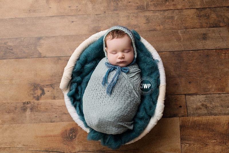 newborn posed portrait boy bucket wood backdrop Kingston baby Photographer