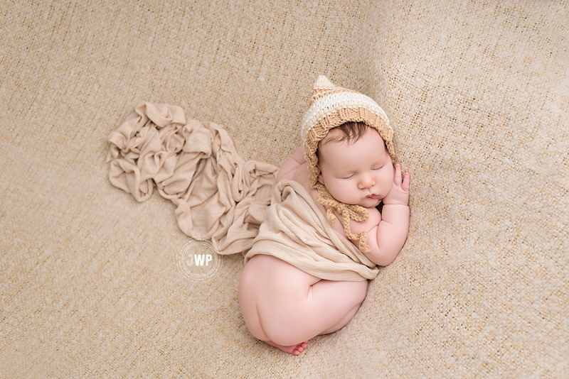 newborn posed portrait cream blanket wrap Kingston baby Photographer