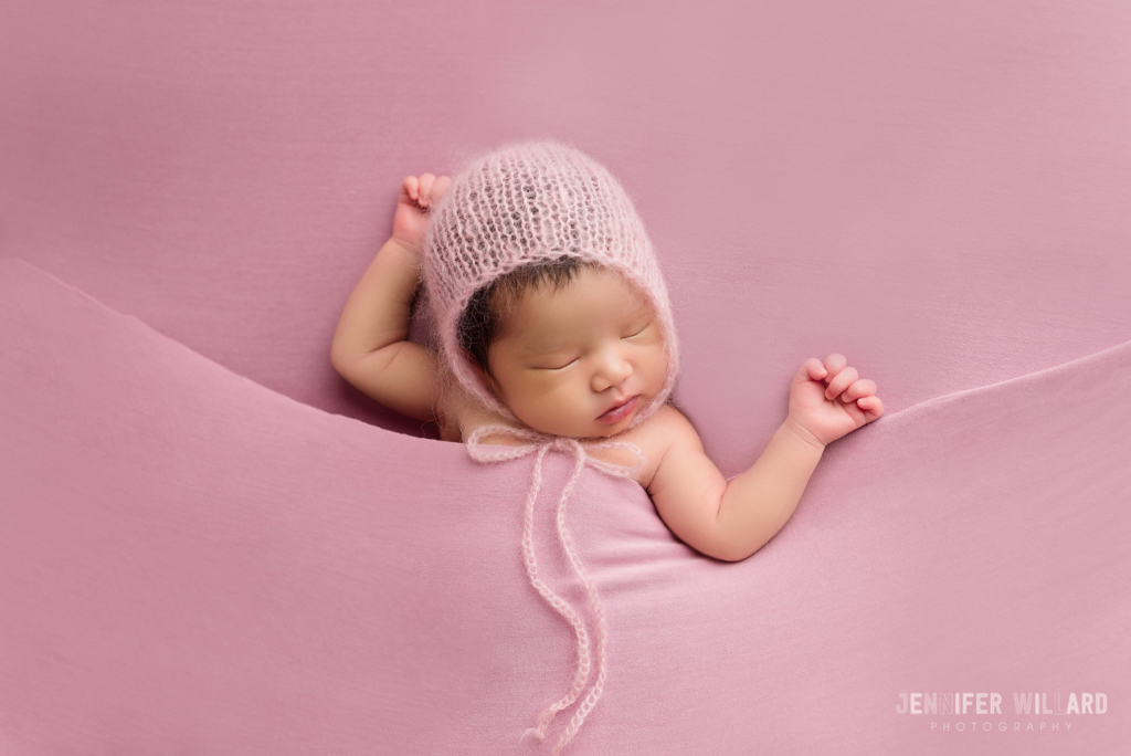 newborn posed portrait pink fabric mohair bonnet sleeping Kingston baby photographer