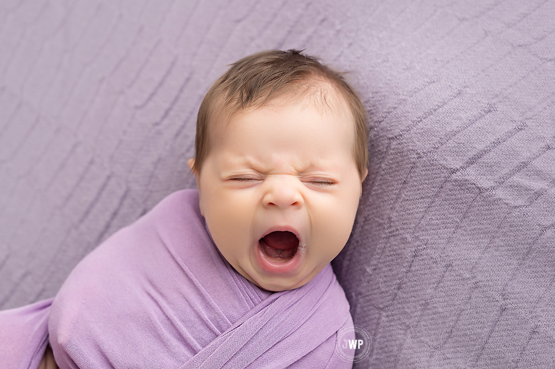 newborn posed portraits baby yawning Kingston Baby Photographer