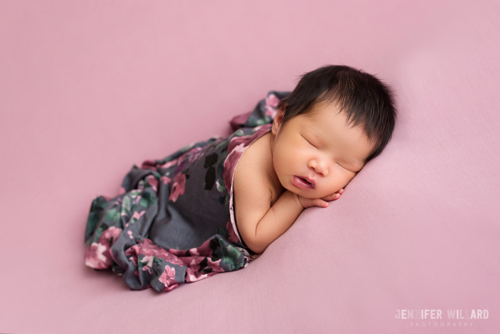 posed baby portrait studio grey floral wrap pink fabric Perth Newborn Photographer