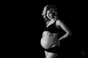 posed pregnancy portrait black and white black backdrop bra panties Kingston Maternity Photographer