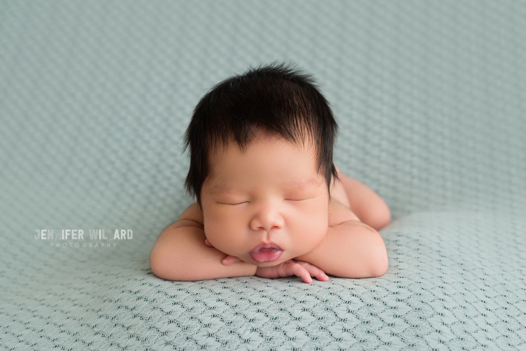 posed studio portrait fabric pose head on hands YGK Photographer