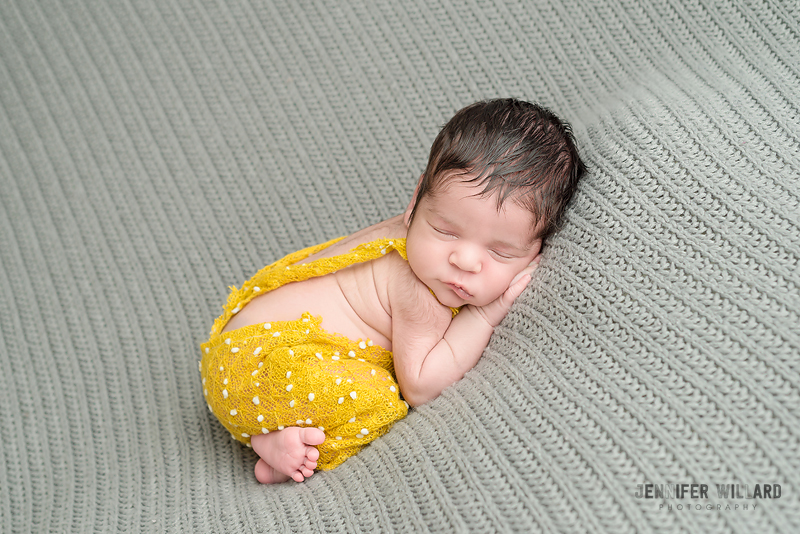 infant posed portrait yellow romper grey blanket Perth Newborn Photographer 