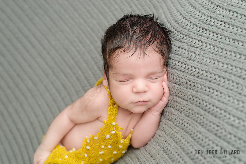 newborn baby boy studio portrait grey blanket yellow romper YGK Photographer