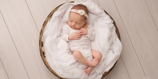 newborn girl white romper basket neutral studio photography Kingston