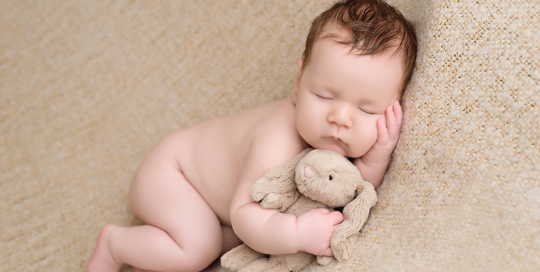 newborn posed portrait cream tan blanket Kingston Ontario Photographer