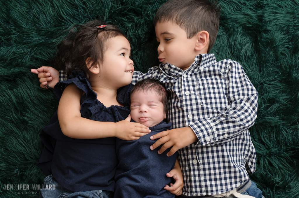 newborn posed portrait siblings green flokati Kingston baby studio