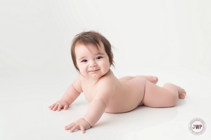 posed baby portrait 6 months old girl dress Kingston Children Photographer