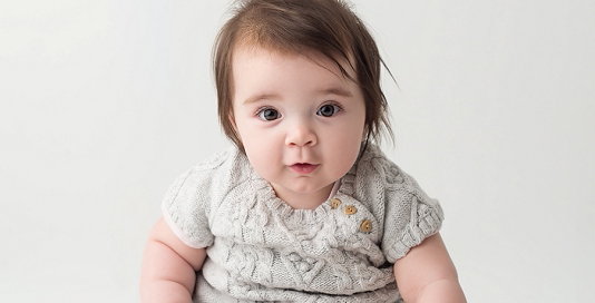 posed baby portrait 6 months old girl dress Kingston Children Photographer