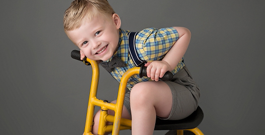 birthday boy 4 years suspenders yellow vintage tricycle Kingston children photographer