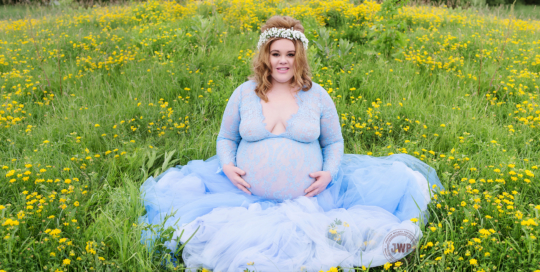 pregnant mother blue tulle skirt flower crown yellow flower field Kingston Maternity Photographer