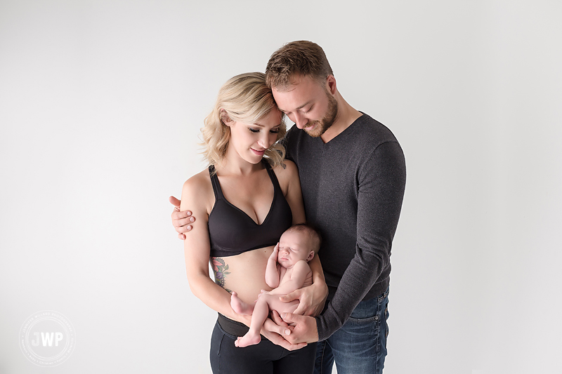 baby boy mother father arms white studio Kingston newborn photographer