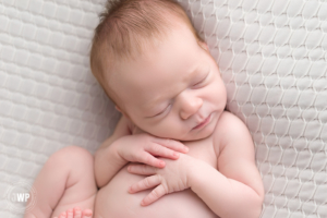 baby boy on back Kingston newborn photographer