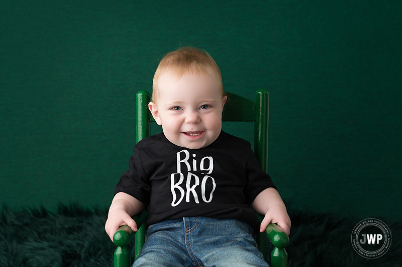 birthday boy smiling green backdrop rocking chair Kingston Photographer