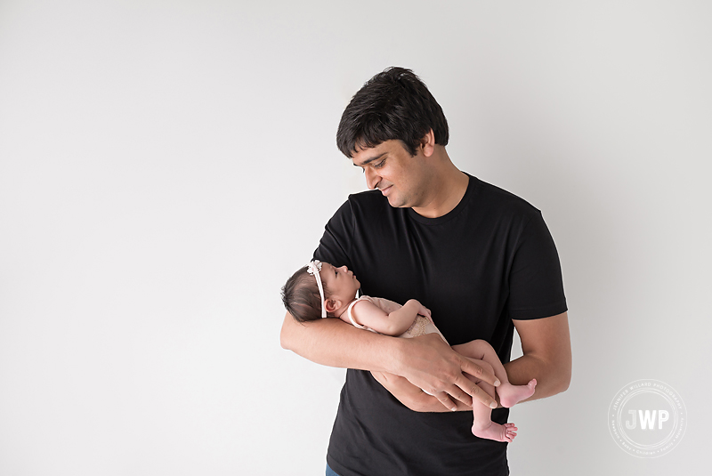 father holding daughter in arms Kingston Photographer